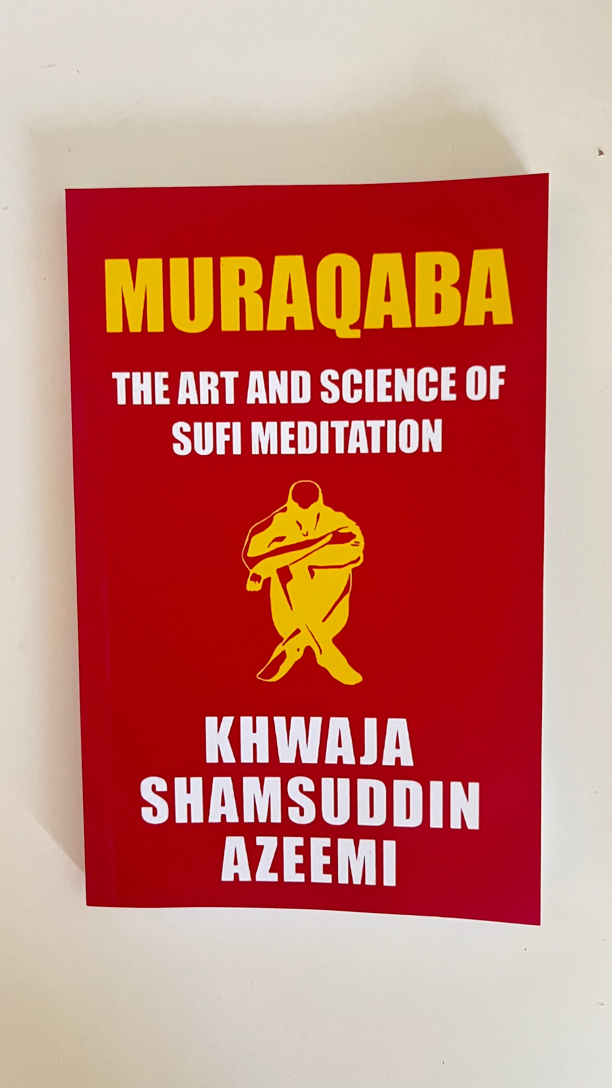 Paperback edition of Muraqba by Khawaja Shamsuddin Azeemi featuring a tranquil cover with meditative symbolism and light.

