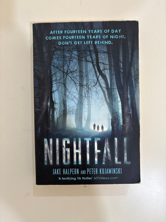 Book cover of 'Nightfall' with a forest scene on a white background