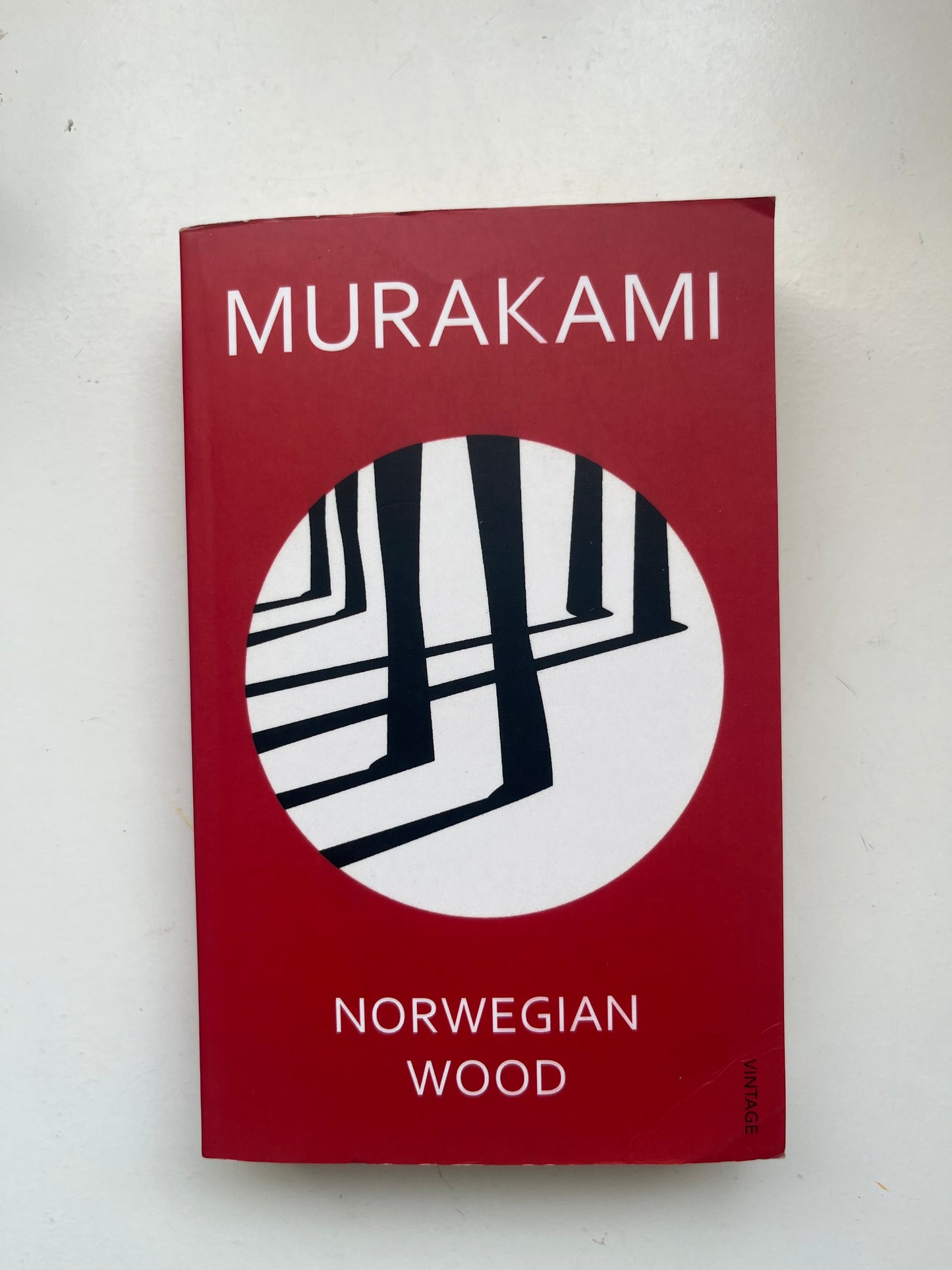 Paperback of Norwegian Wood by Haruki Murakami featuring a minimalist, moody design.

