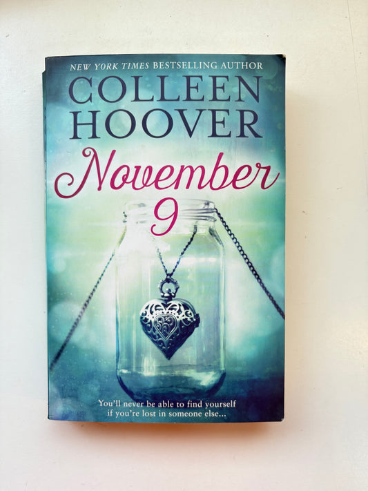 Book cover of 'November 9' by Colleen Hoover with a necklace in a bottle illustration.