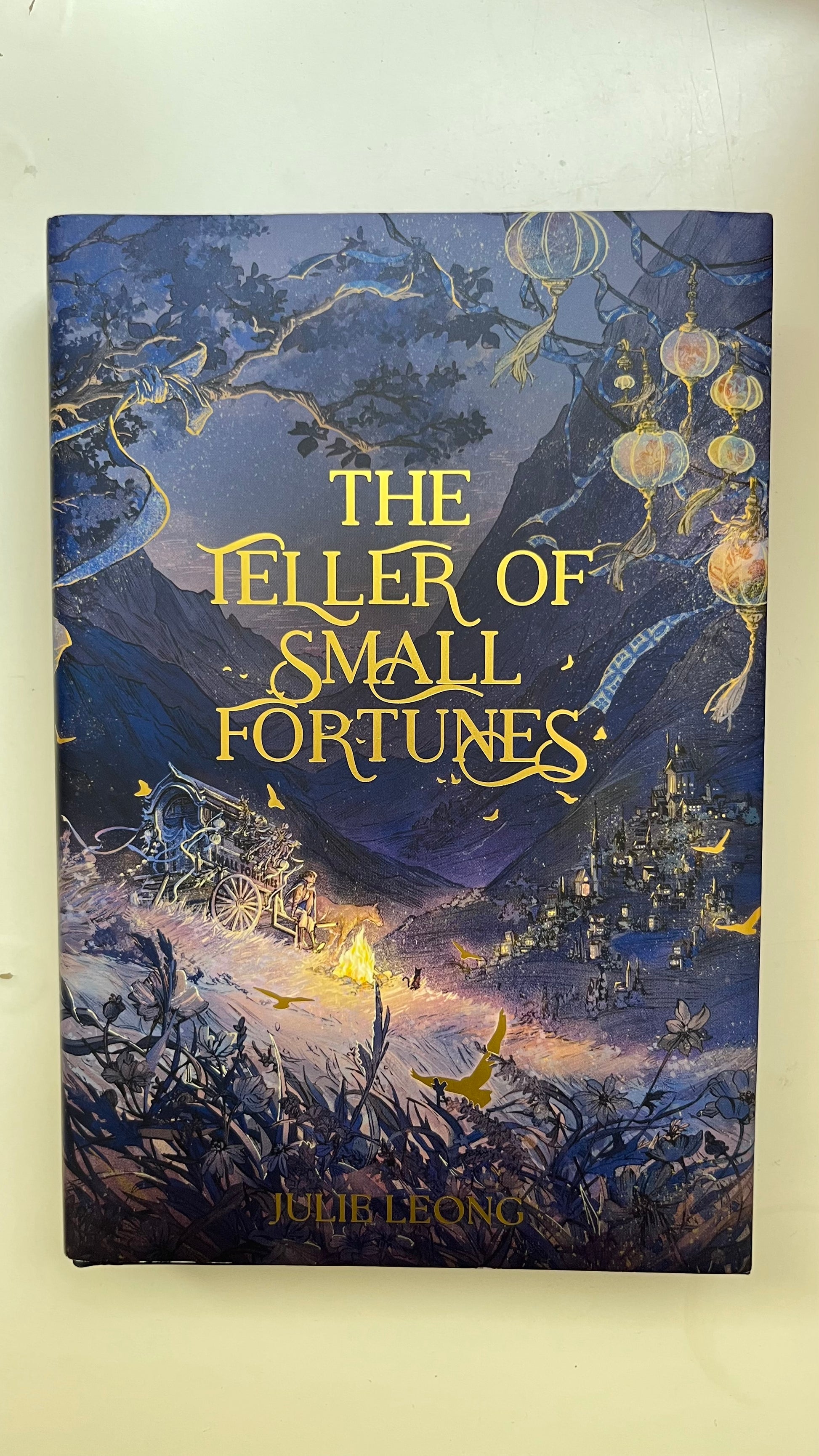 OwlCrate exclusive edition – The Teller of Small Fortunes hardcover in UAE"

"Limited edition The Teller of Small Fortunes with sprayed edges and artwork"