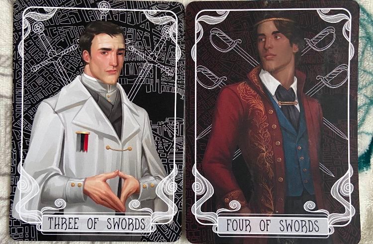 Two tarot cards featuring portraits of men labeled 'Three of Swords' and 'Four of Swords'.