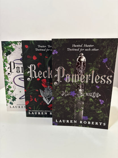 Book titled 'Black Promises' by Lauren Roberts on a white background