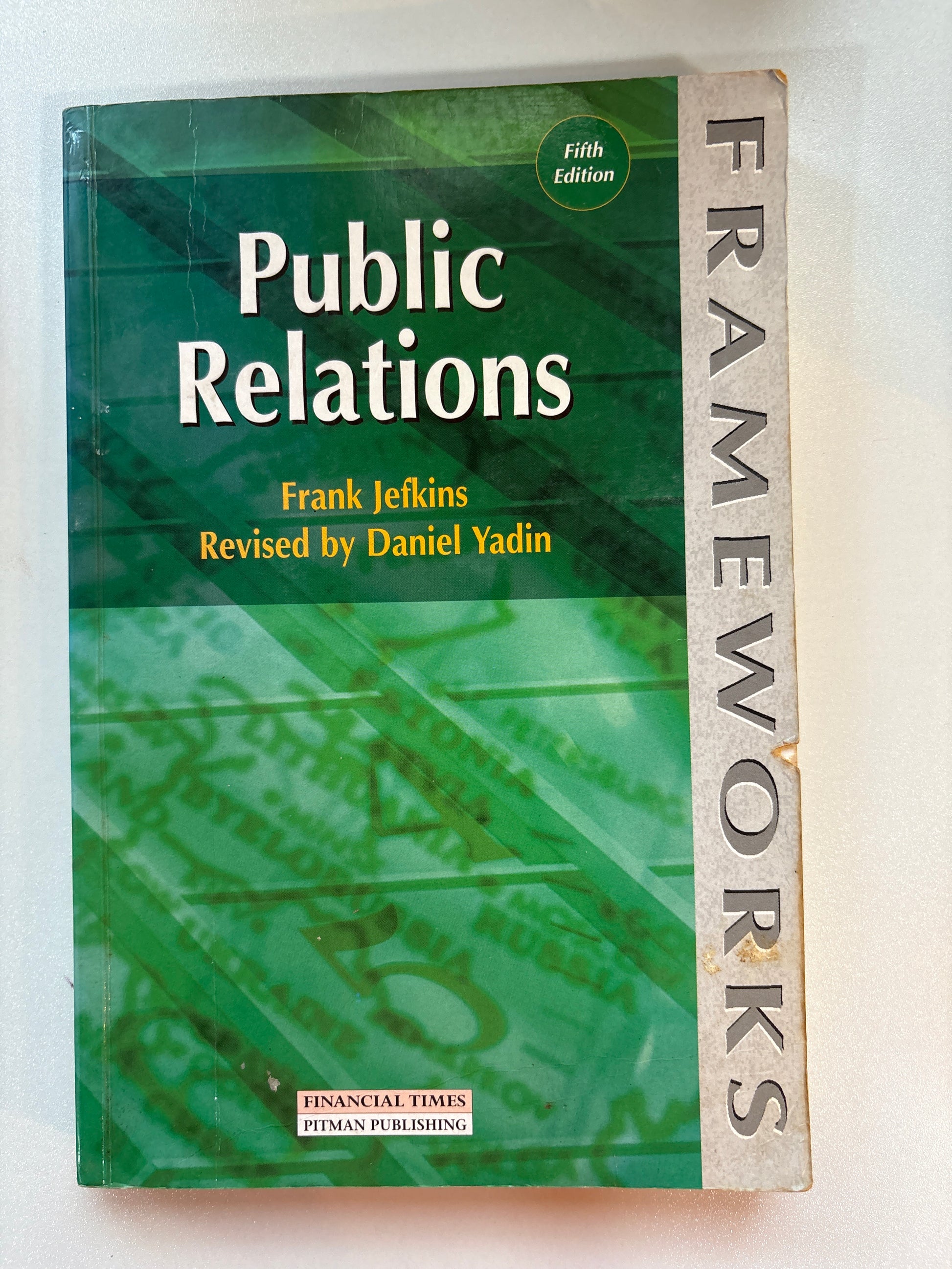 Book titled 'Frameworks of Public Relations' on a white background