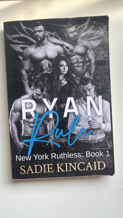 Paperback of Ryan Rule by Kelsie Rae featuring a bold, contemporary romance cover.


