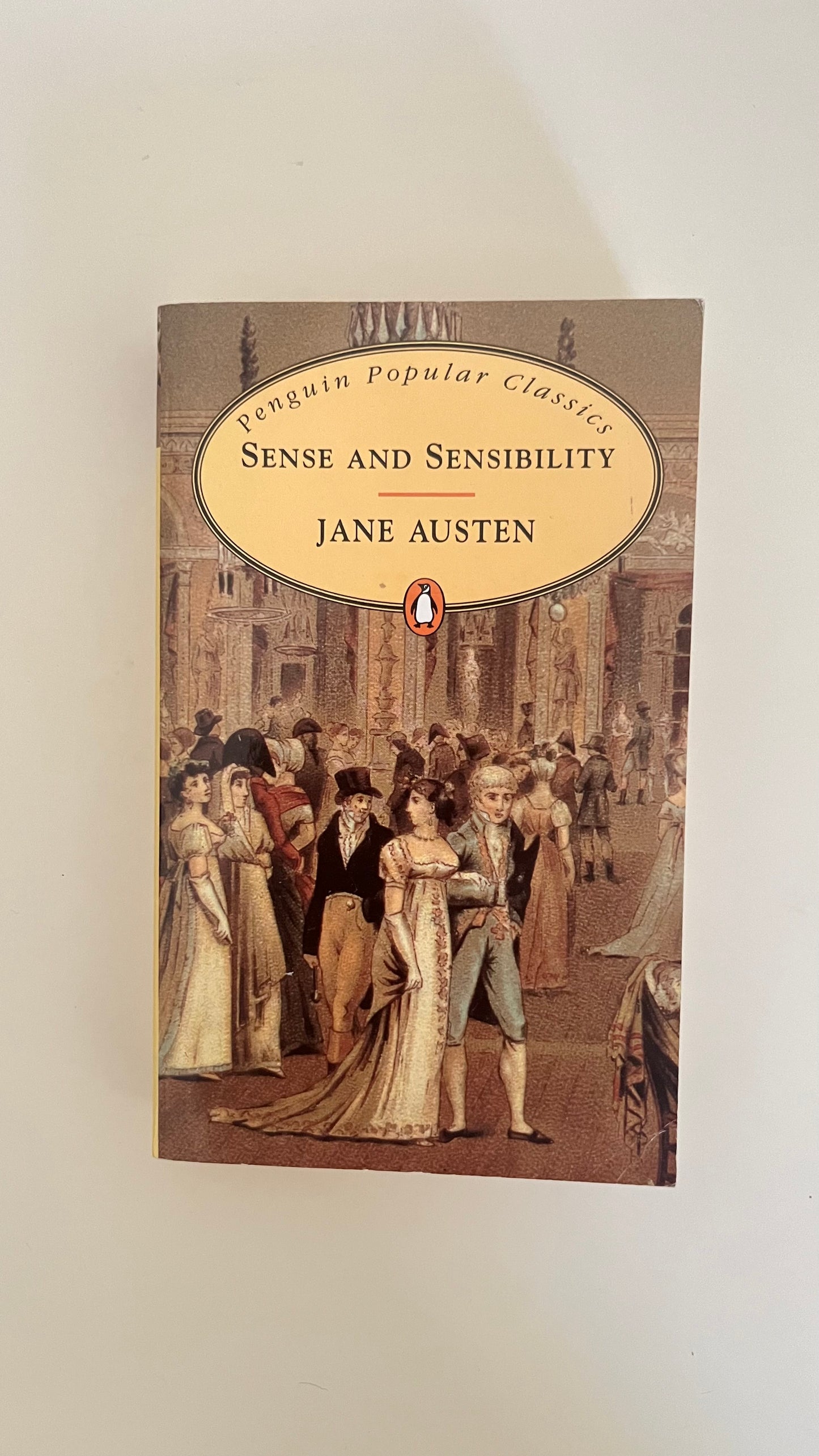 Paperback of Sense and Sensibility by Jane Austen with classic Regency-era cover design.

