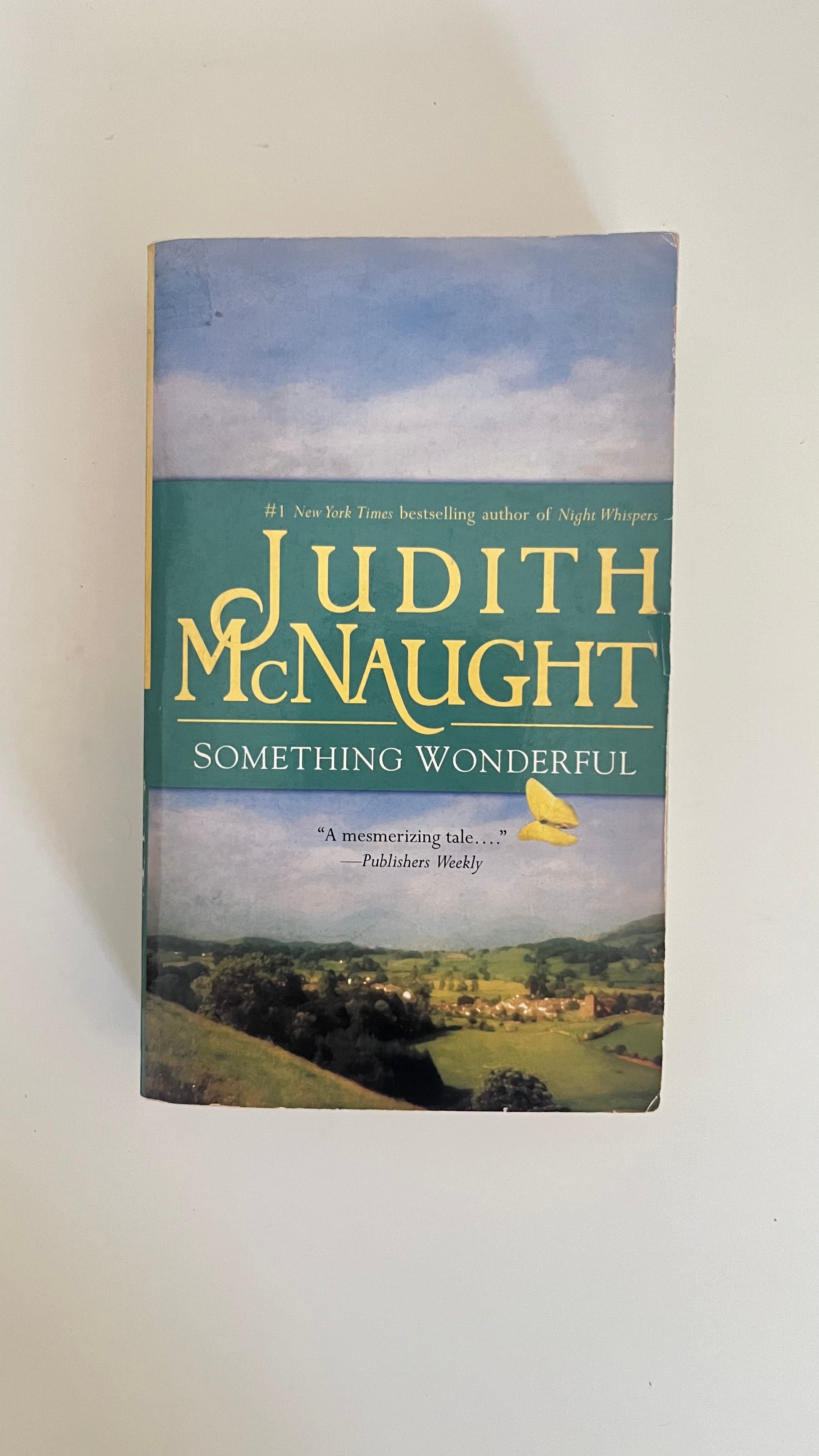 Paperback edition of Something Wonderful by Judith McNaught featuring a classic romantic couple in historical attire.

