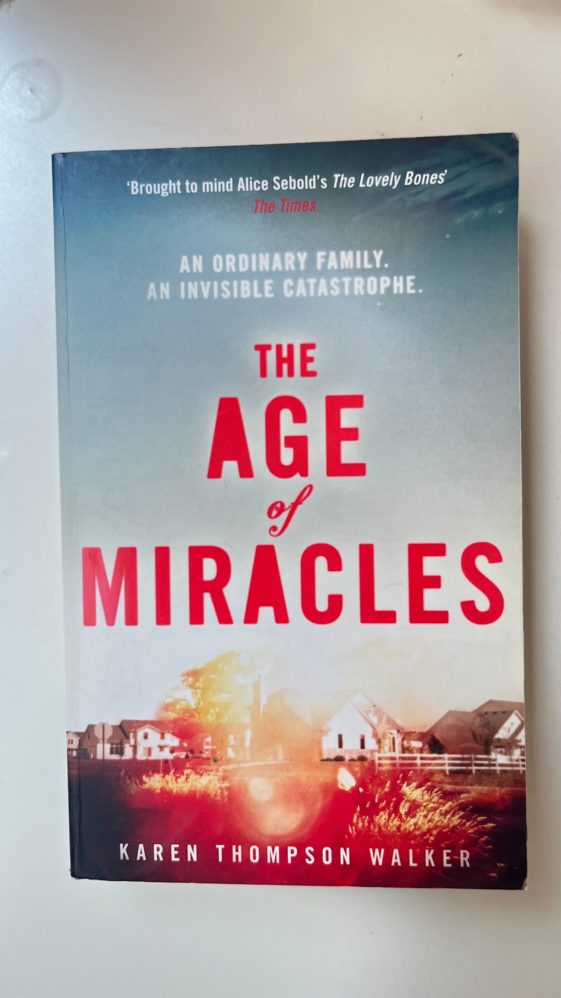 Paperback of The Age of Miracles with surreal, twilight-hued cover art.

