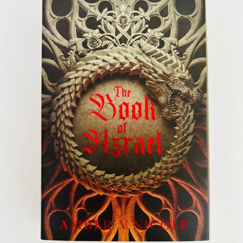 Book cover of 'The Book of Azrael' with a dragon design and intricate details.