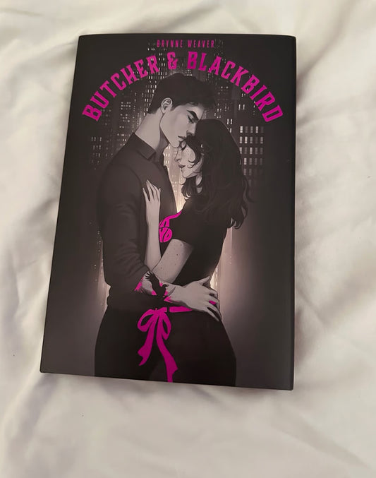 Book cover of 'Butcher & Blackbird' with a couple embracing against a city skyline.