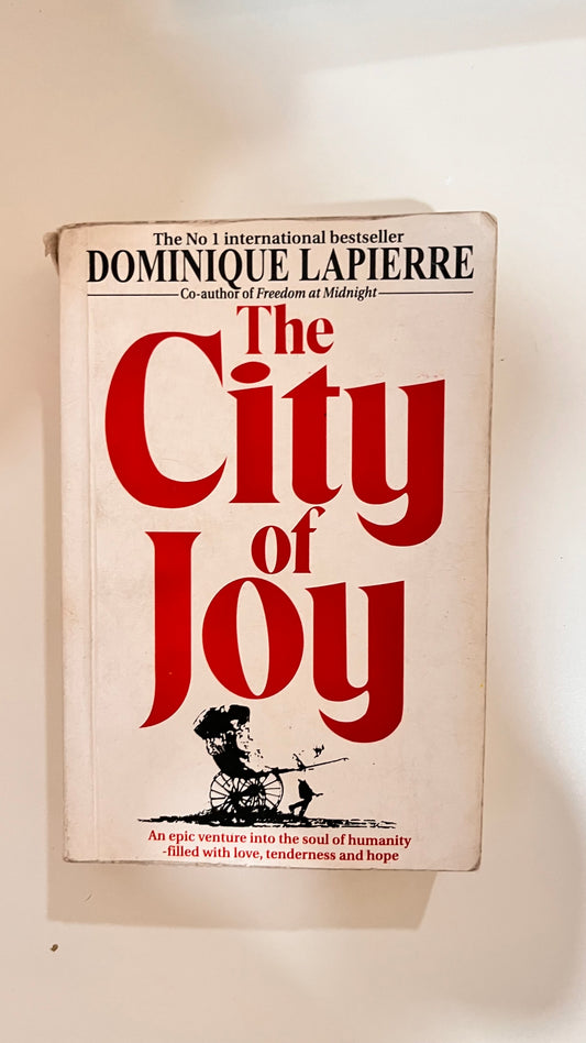 Paperback of The City of Joy by Dominique Lapierre, capturing an emotional cover.

