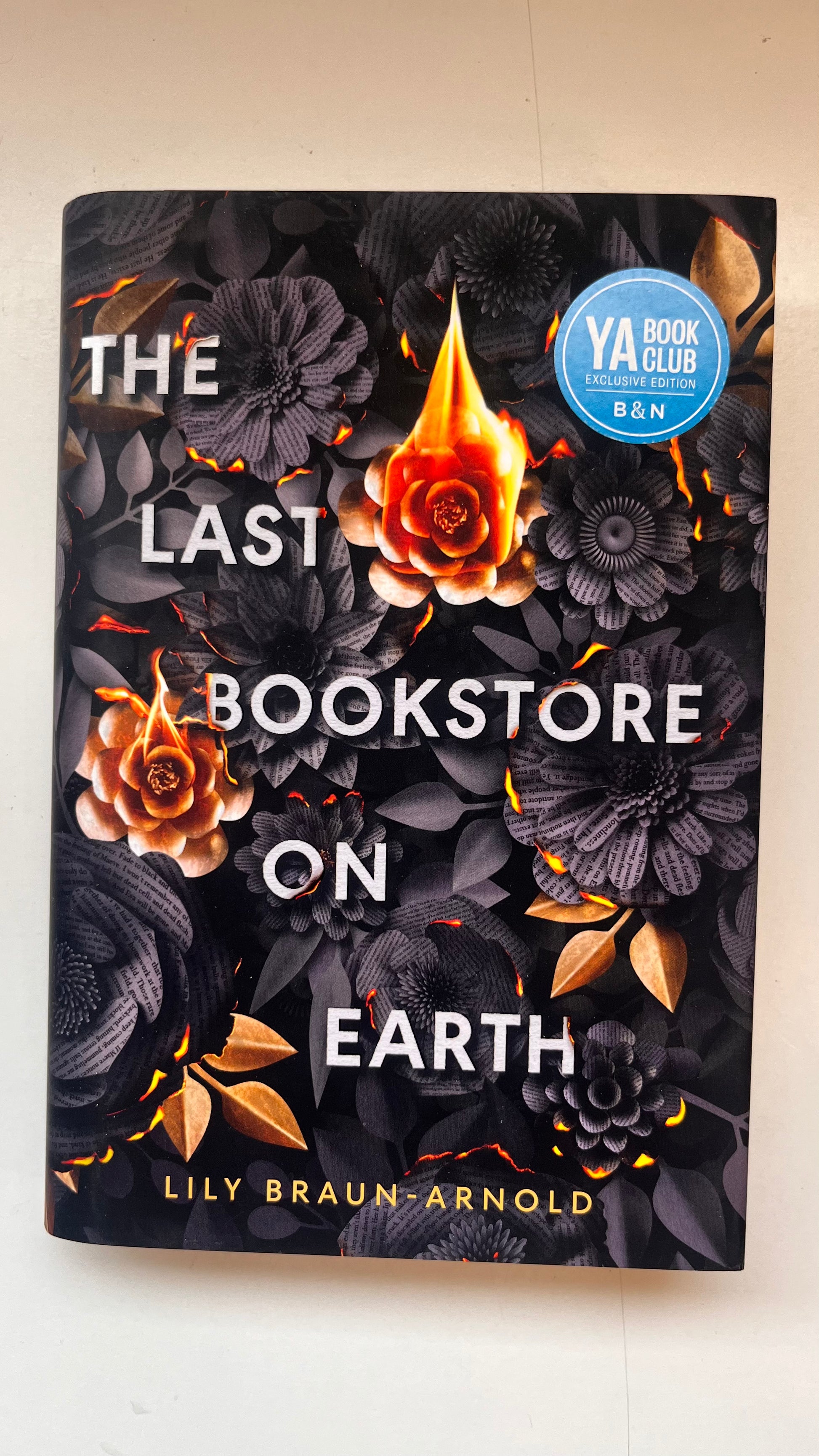 Book cover of 'The Last Bookstore on Earth' with floral design and YA Book Club label.