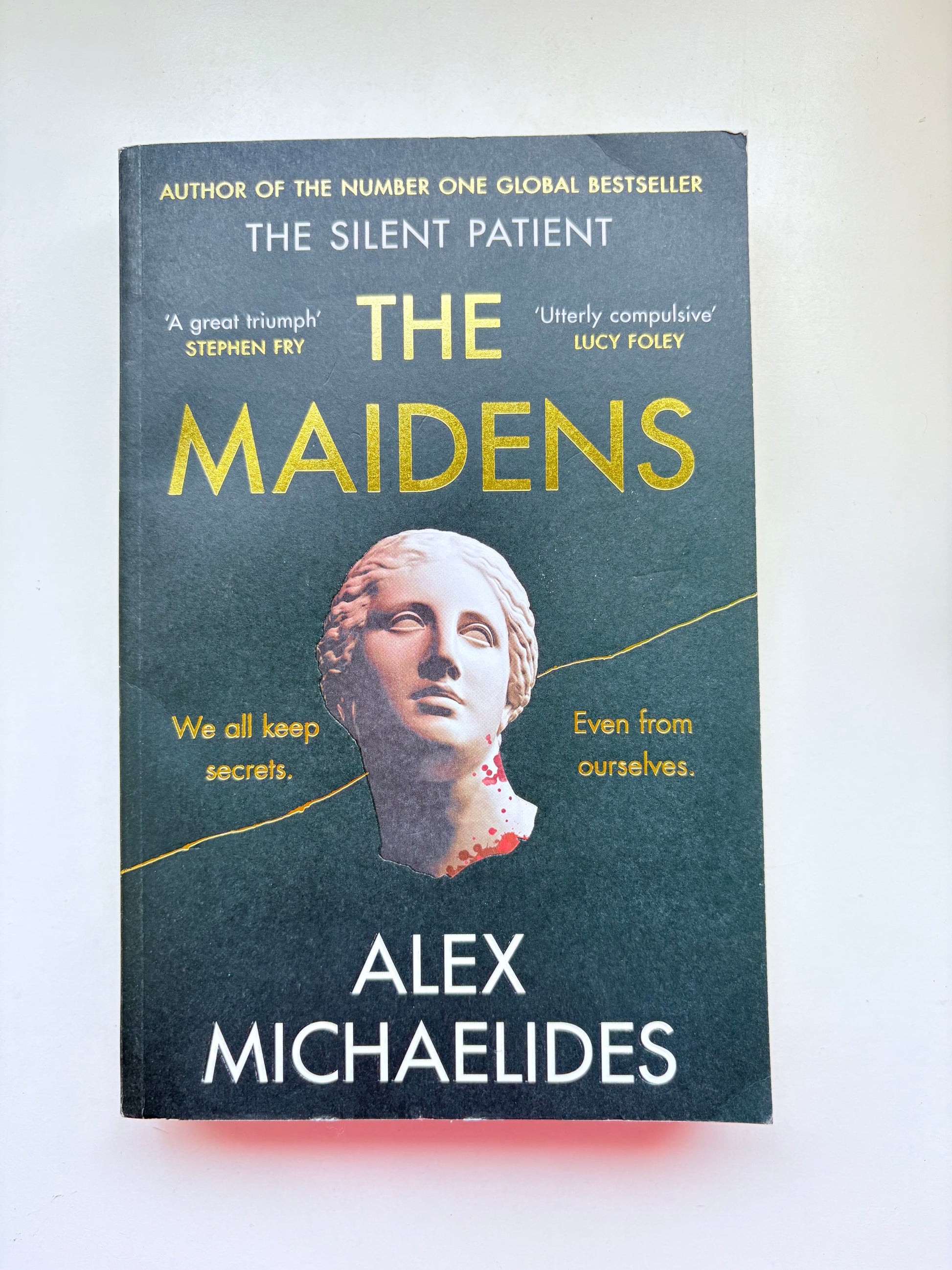 Book cover of 'The Maidens' by Alex Michaelides on a white background