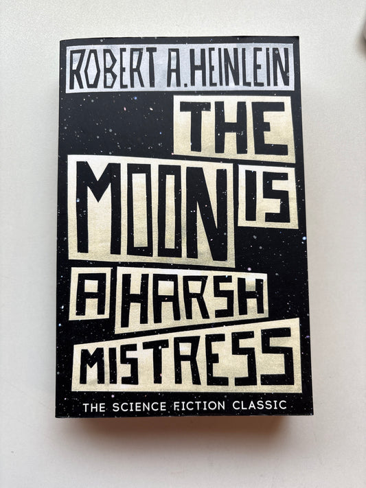 Book cover of 'The Mine's Harsh Mistress' by Robert A. Heinlein on a white background