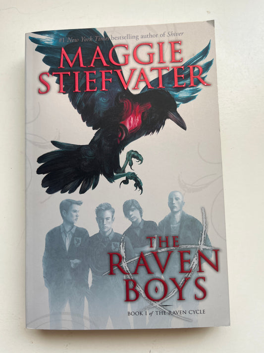 Cover of The Raven Boys by Maggie Stiefvater, featuring ravens and magical themes.