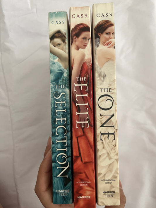 The Selection trilogy set by Kiera Cass with elegant covers featuring ball gowns