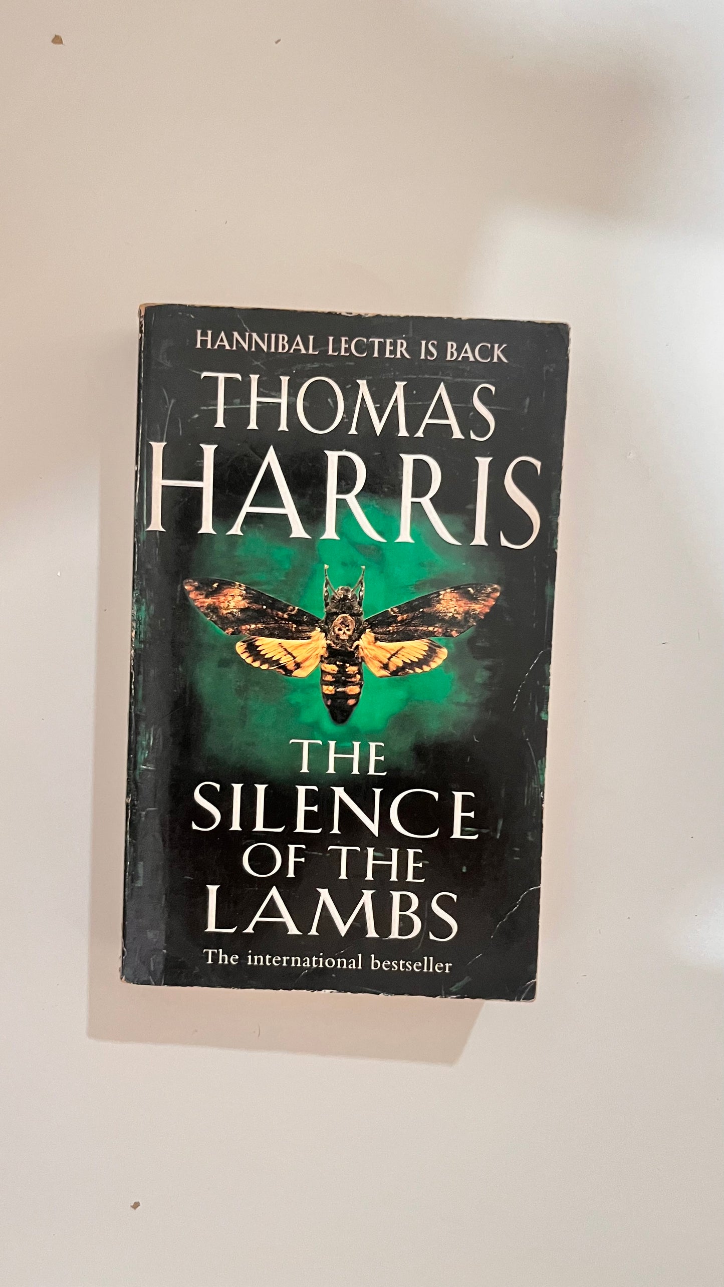 Paperback of The Silence of the Lambs by Thomas Harris, with a chilling and iconic cover.

