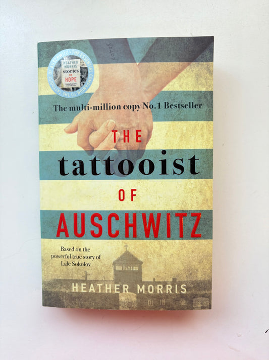 Book cover of 'The Tattooist of Auschwitz' by Heather Morris on a white background