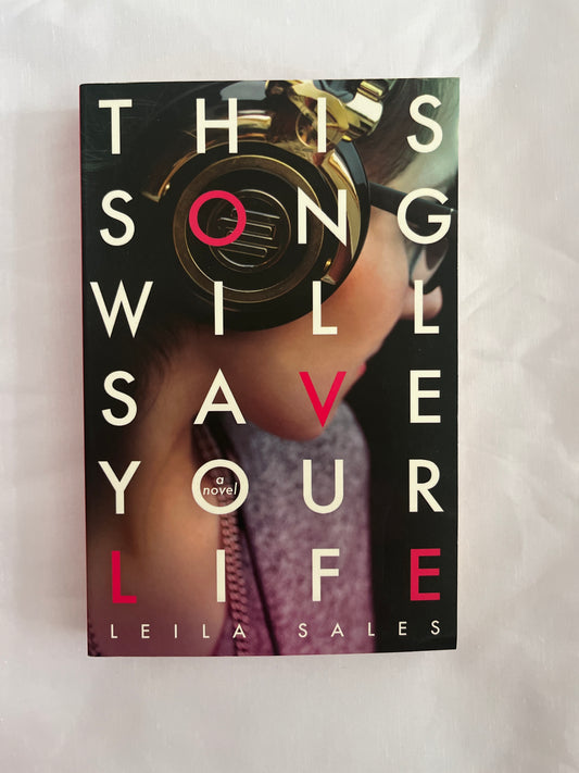  Cover of This Song Will Save Your Life by Leila Sales featuring neon typography over a girl standing alone in a city at night