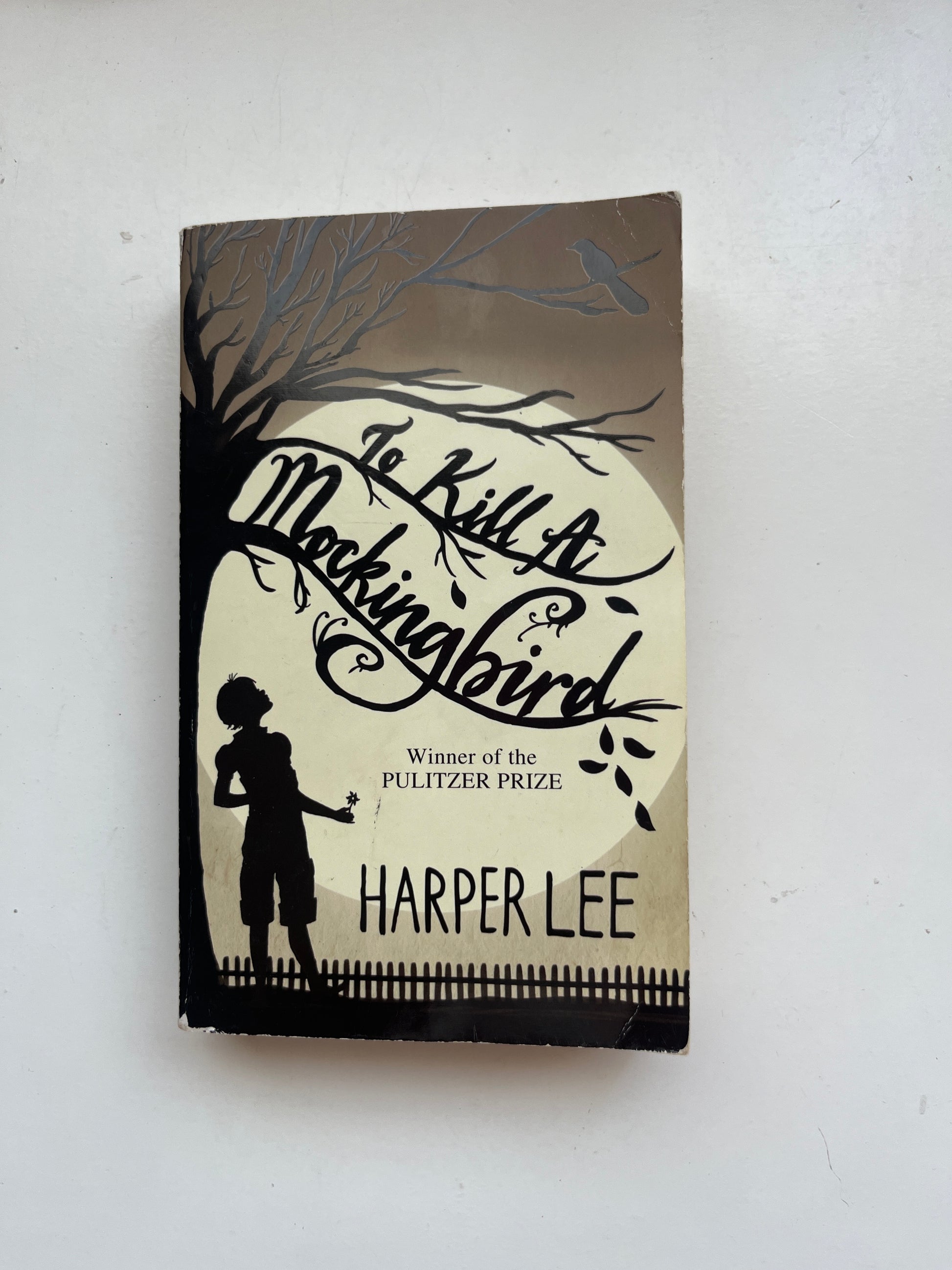 Cover of To Kill a Mockingbird by Harper Lee, featuring symbolic imagery like a mockingbird or tree.