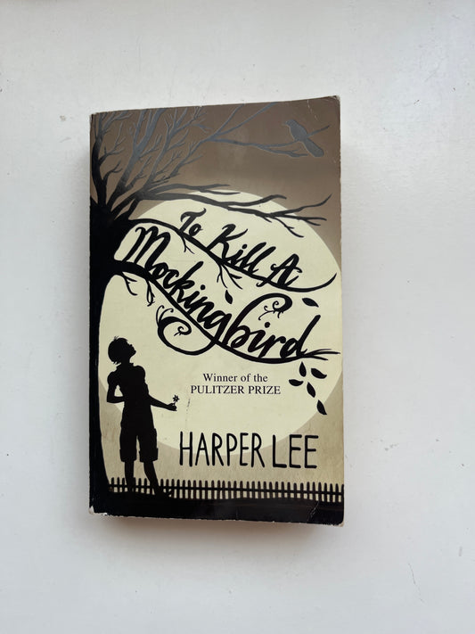 Cover of To Kill a Mockingbird by Harper Lee, featuring symbolic imagery like a mockingbird or tree.